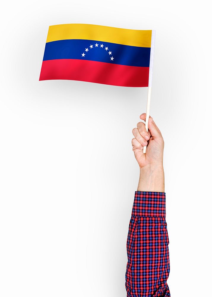 Person waving the flag of Bolivarian Republic of Venezuela