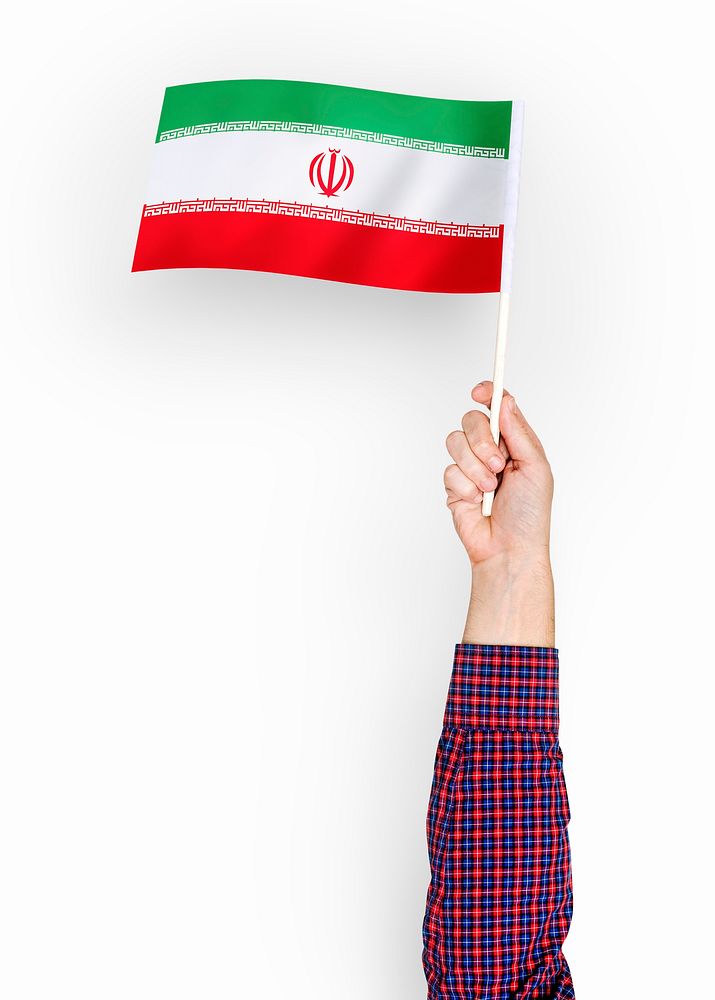 Person waving the flag of Islamic Republic of Iran