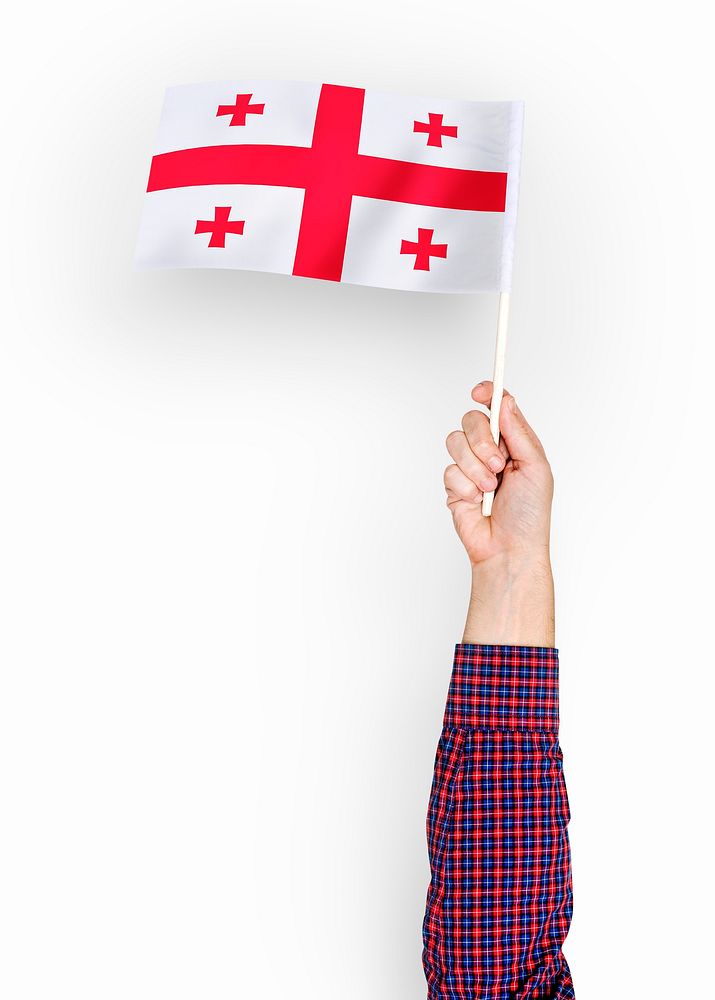 Person waving the flag of Georgia