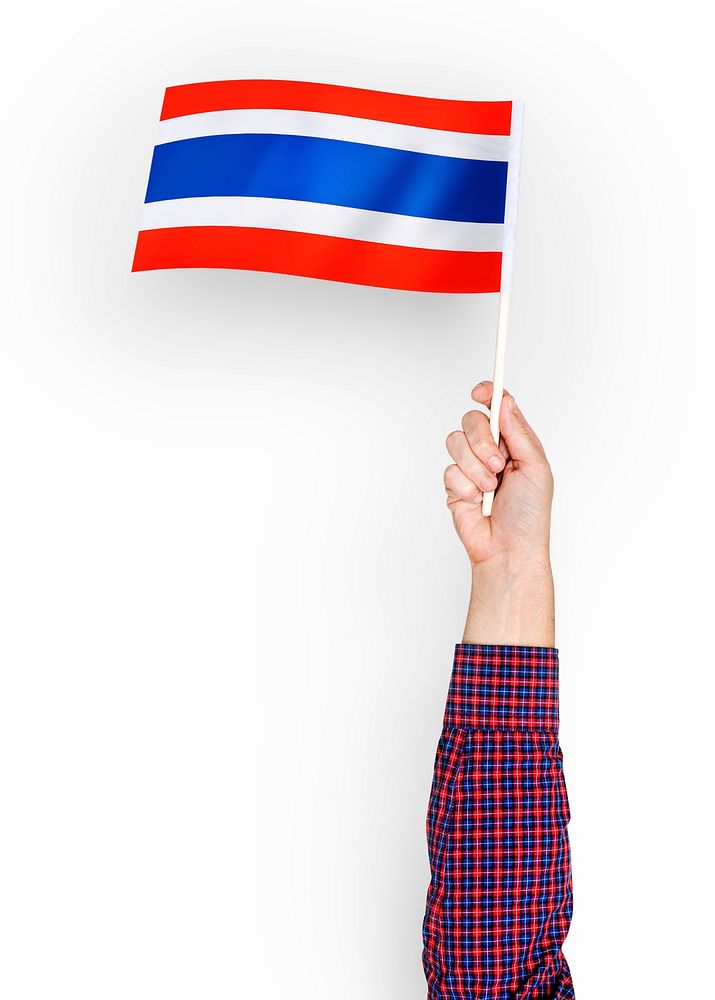 Person waving the flag of Kingdom of Thailand