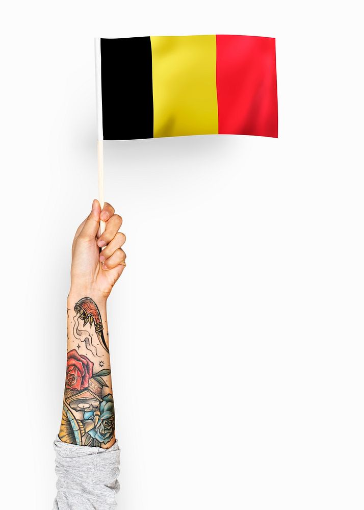 Person waving the flag of Kingdom of Belgium