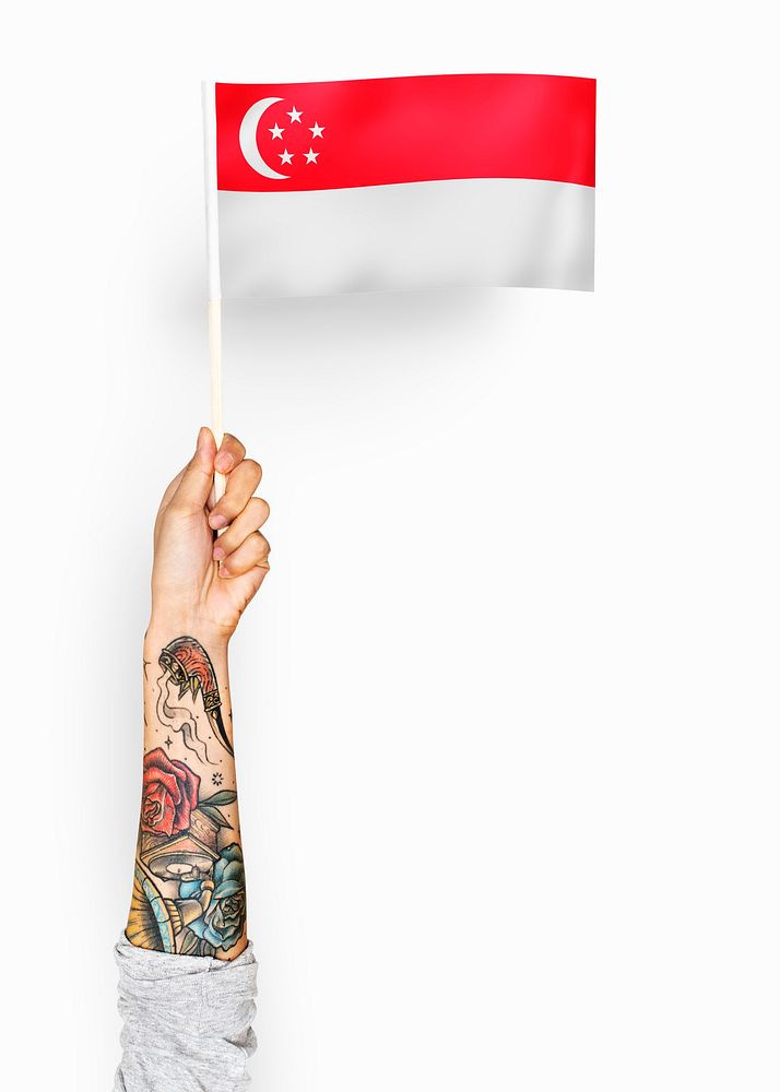 Person waving the flag of Republic of Singapore