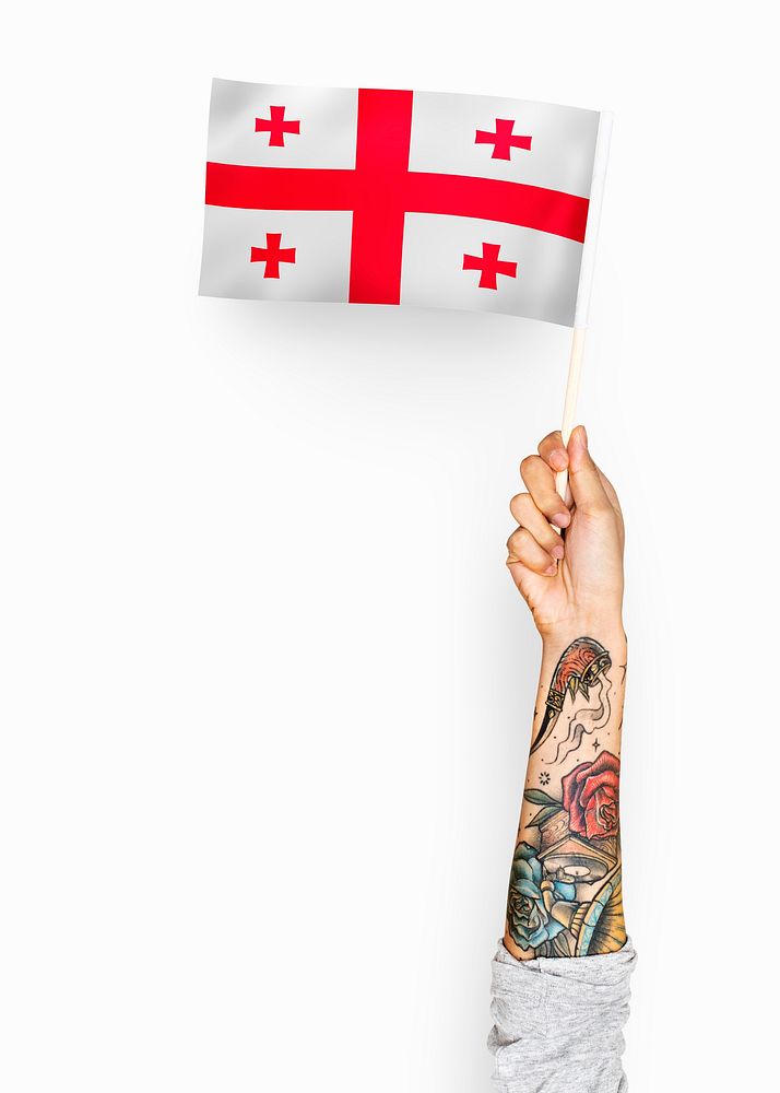 Person waving the flag of Georgia