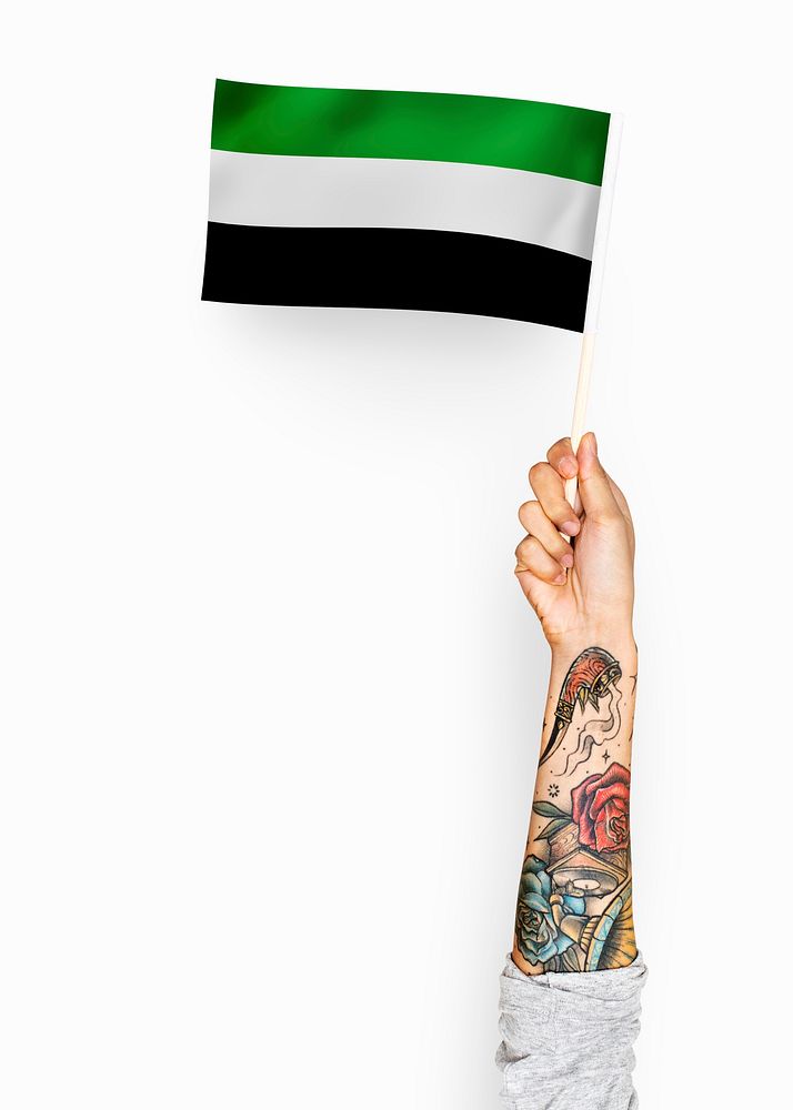 Person waving the flag of Islamic State of Afghanistan