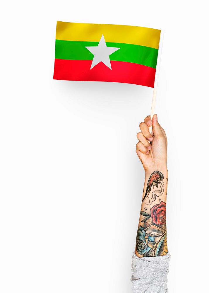 Person waving the flag of Republic of the Union of Myanmar