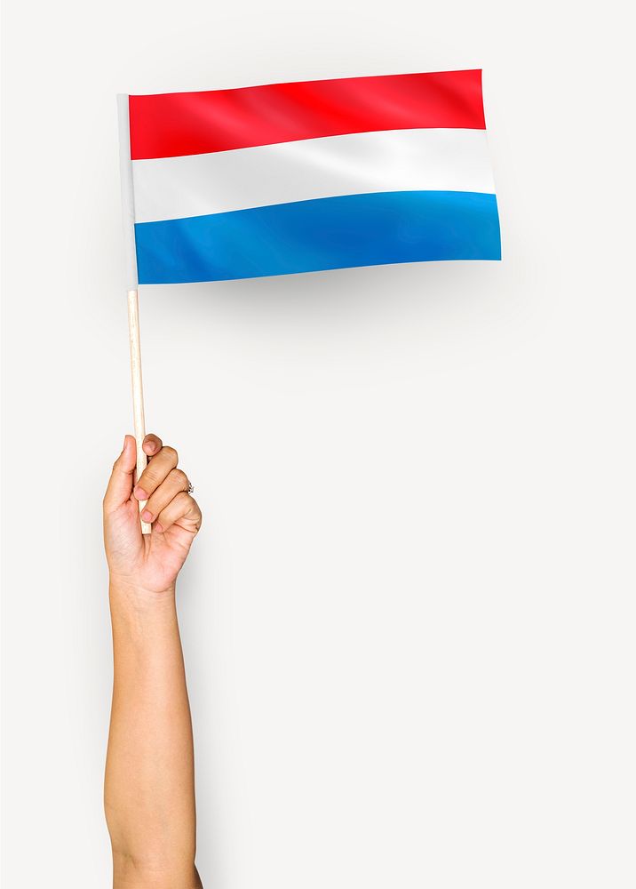 Person waving the flag of Grand Duchy of Luxembourg