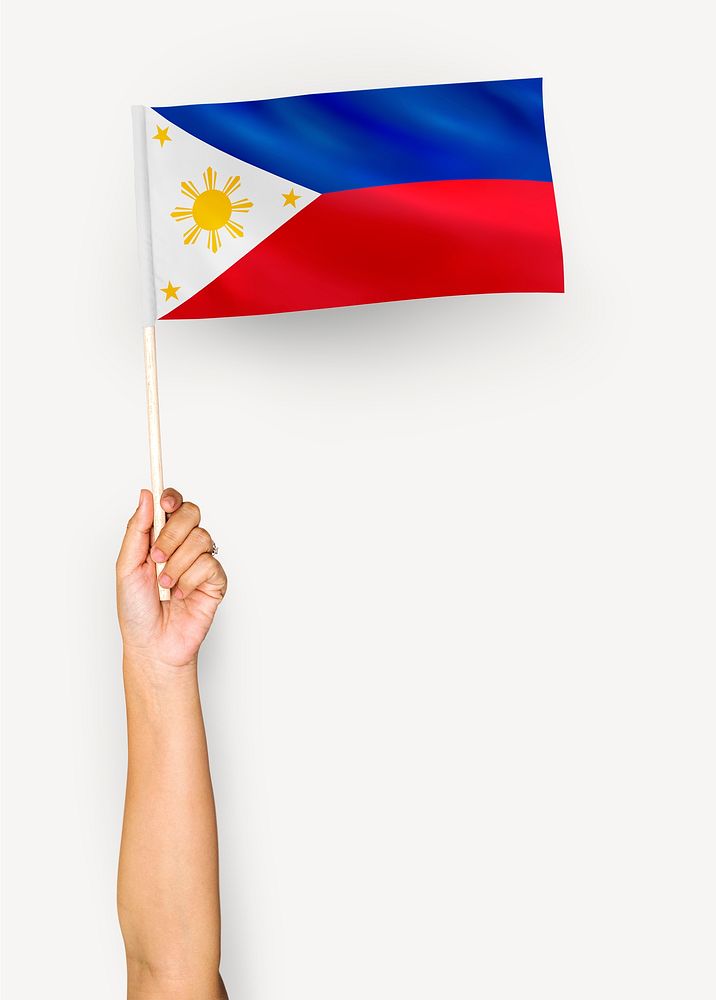 Person waving the flag of Republic of the Philippines
