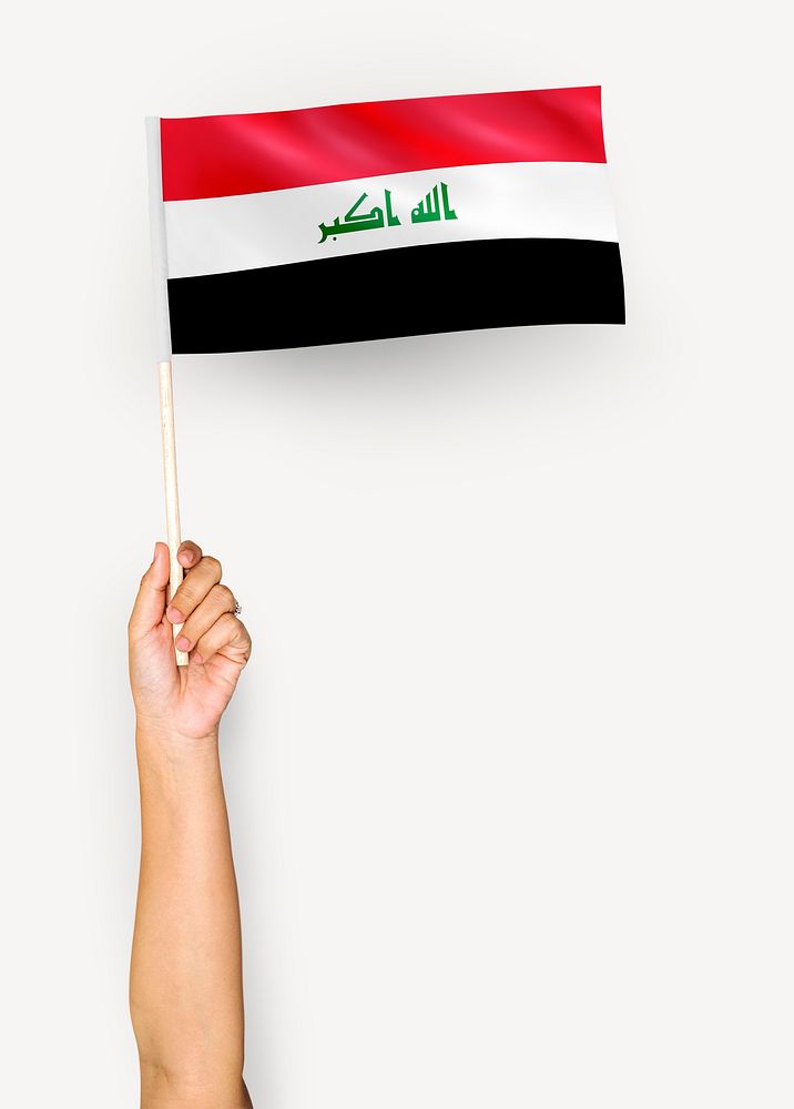 Person waving the flag of Republic of Iraq
