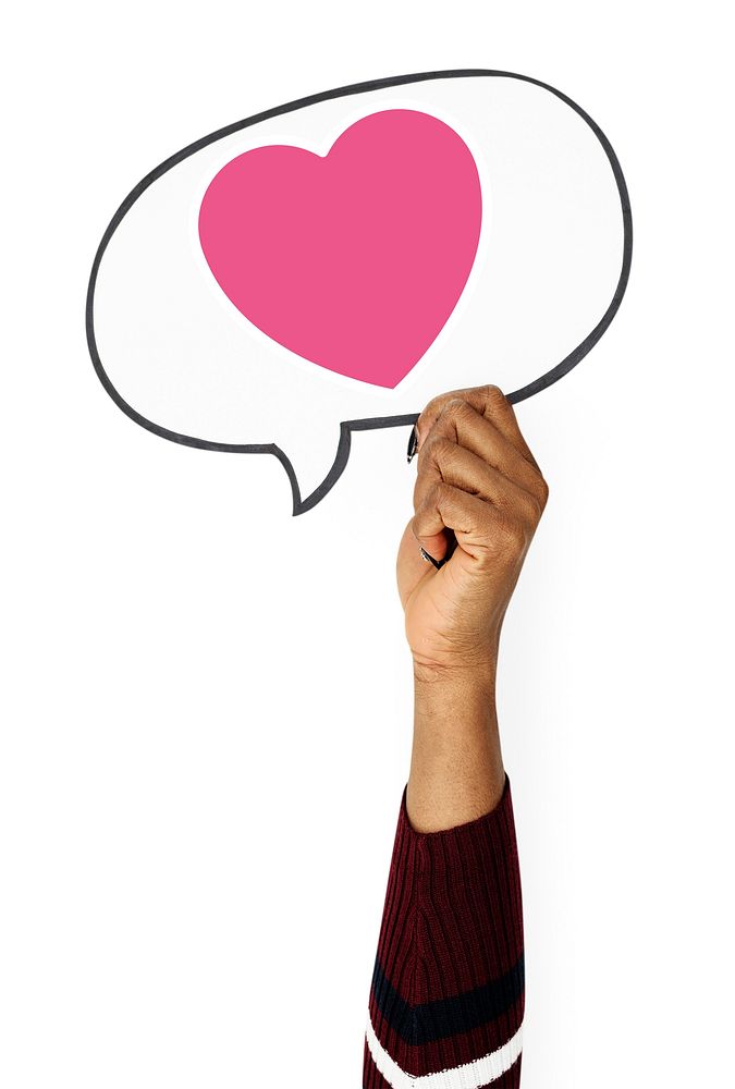 Hand holding speech bubble with heart icon