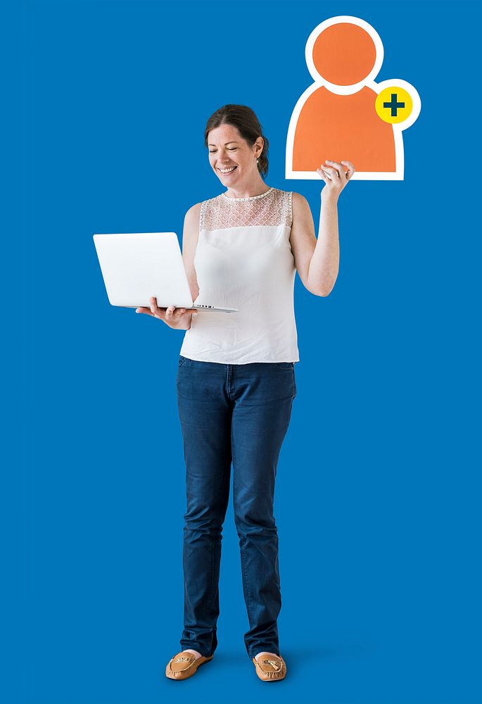 Woman holding a friend request icon and a laptop