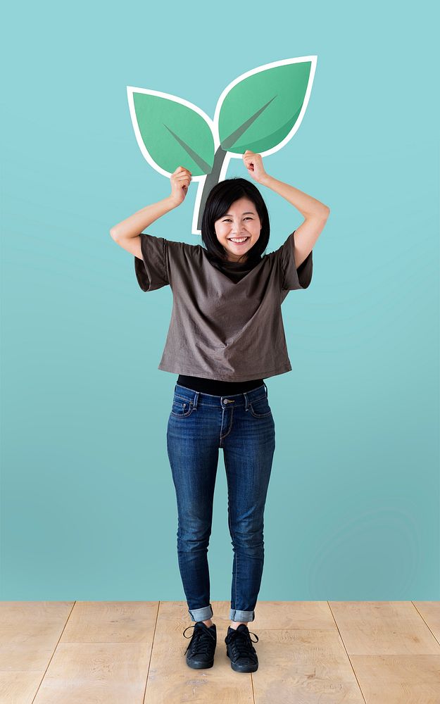 Cheerful woman holding a plant icon