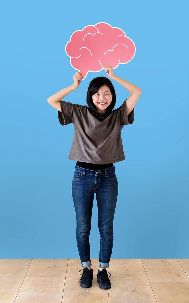Cheerful woman holding a brain icon