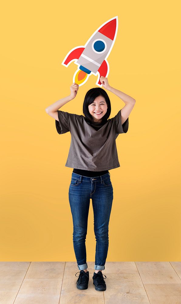 Cheerful woman holding a rocket icon