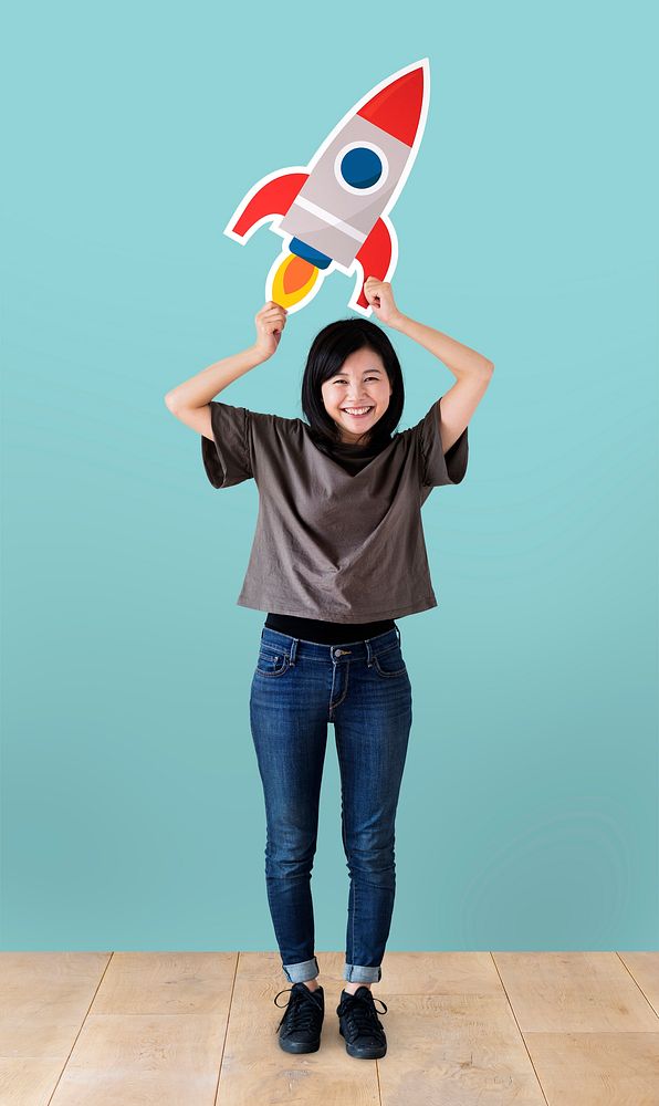 Cheerful woman holding a rocket icon