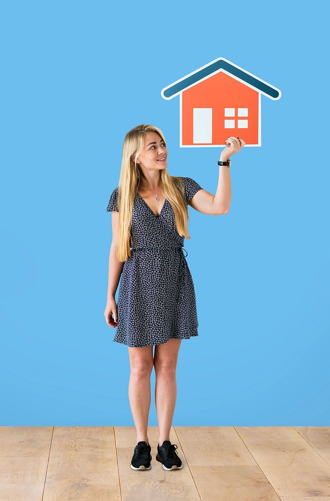 Cheerful woman holding a house icon