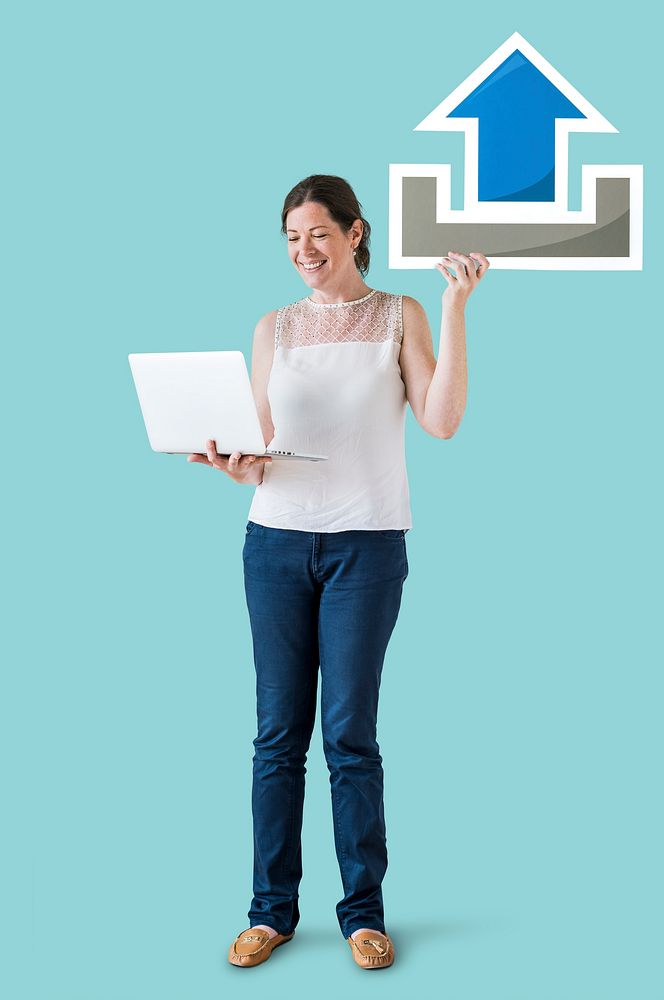 Woman holding an upload icon and a laptop