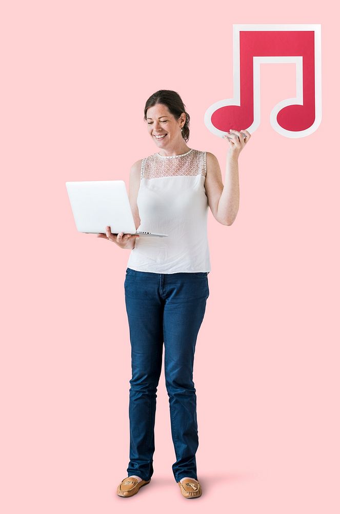 Woman holding a musical note and a laptop