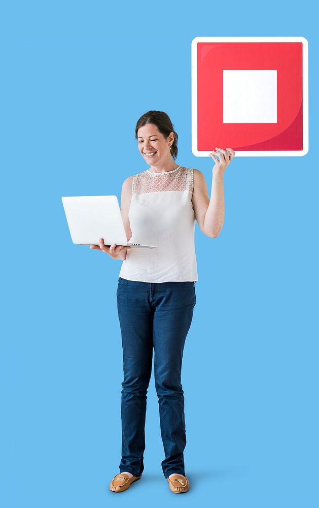 Woman holding a stop button and a laptop