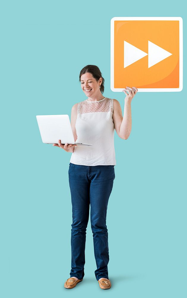 Woman carrying a fast forward button and a laptop