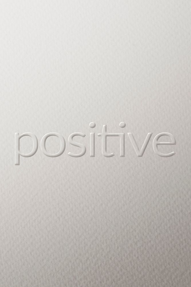 Positive embossed font white paper background