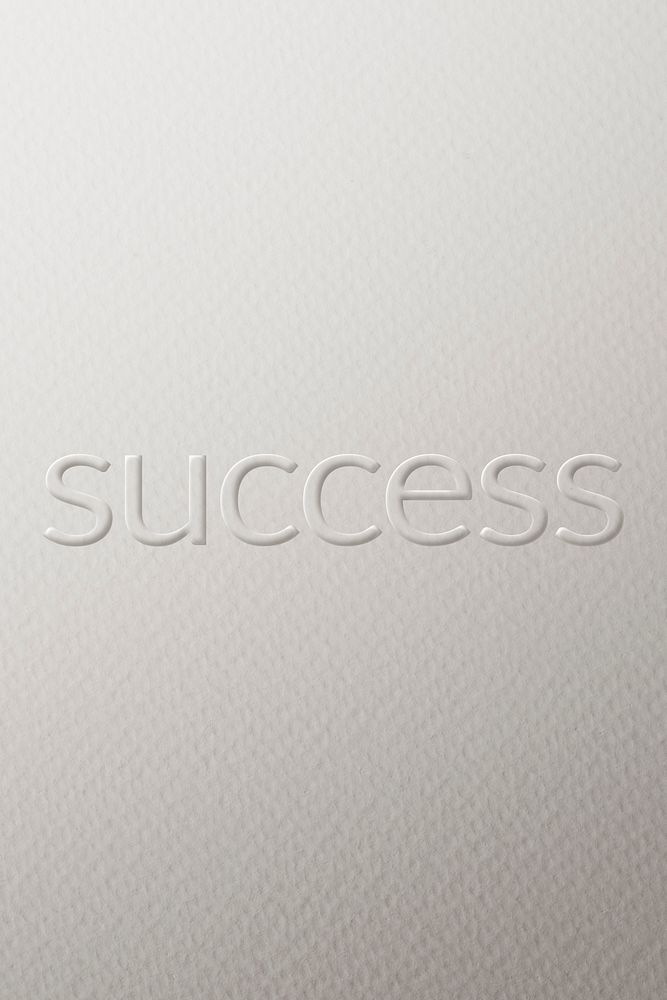 Success embossed font white paper background