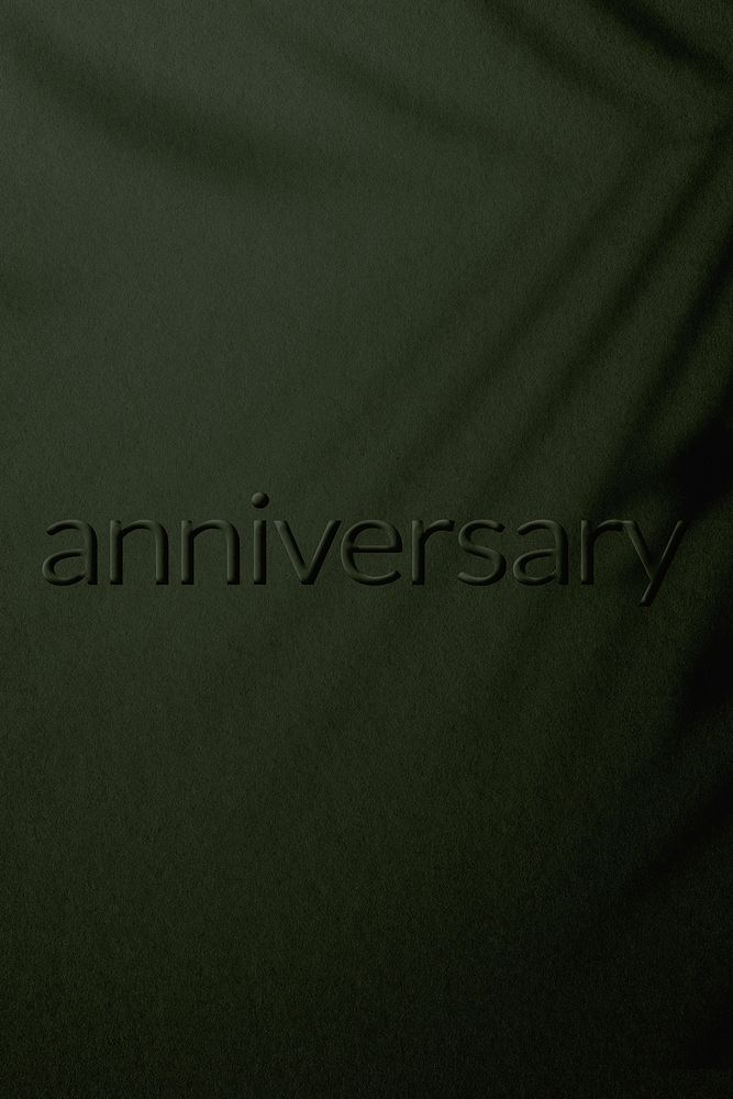 Anniversary word embossed concrete texture shadow plant