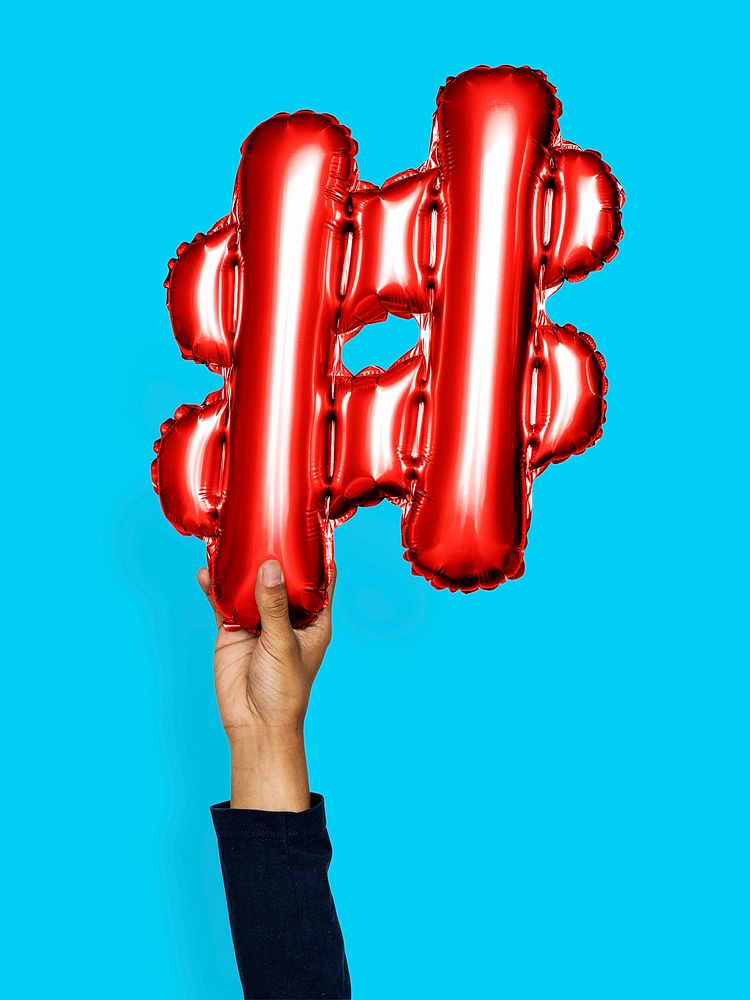 Hand holding balloon hashtag symbol #