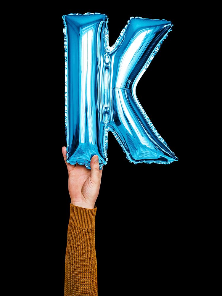 Hand holding balloon letter K