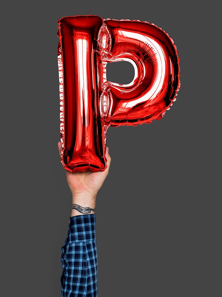 Hand holding balloon letter P