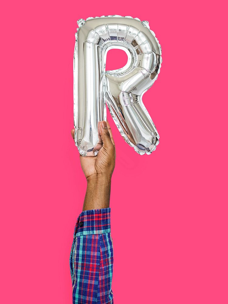 Hand holding balloon letter R