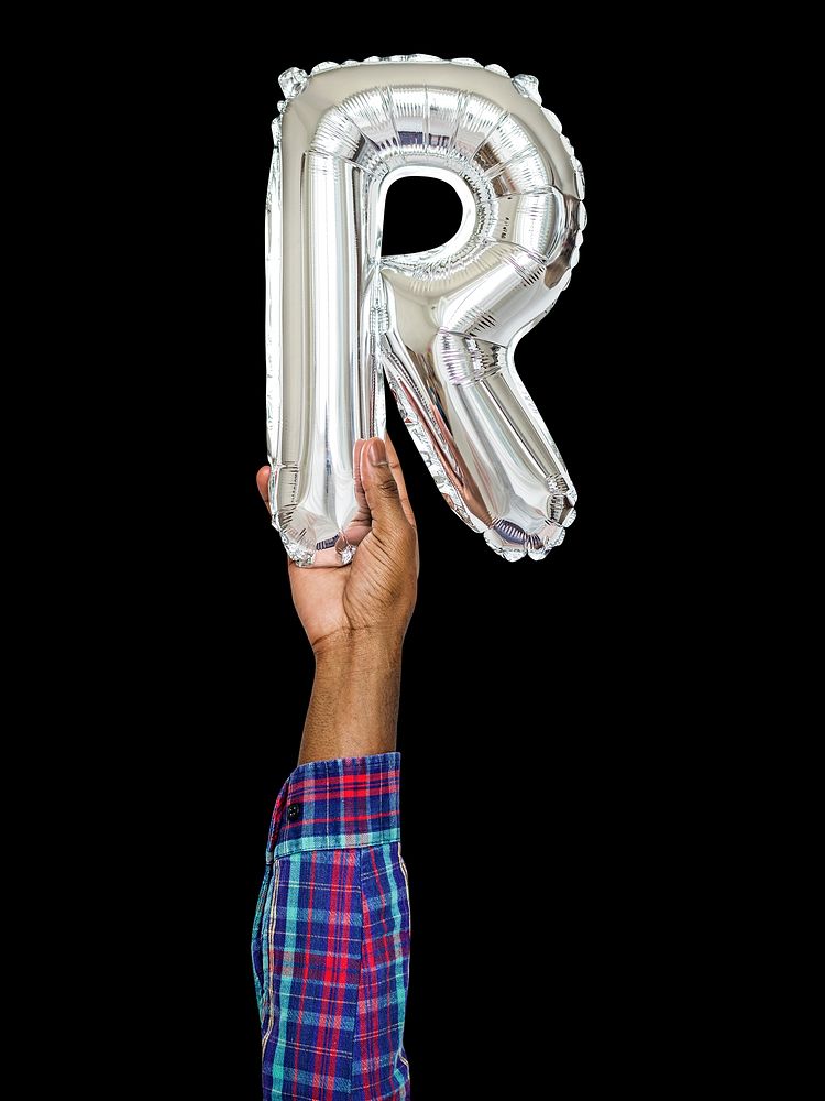 Hand holding balloon letter R