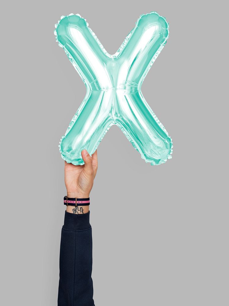 Hand holding balloon letter X