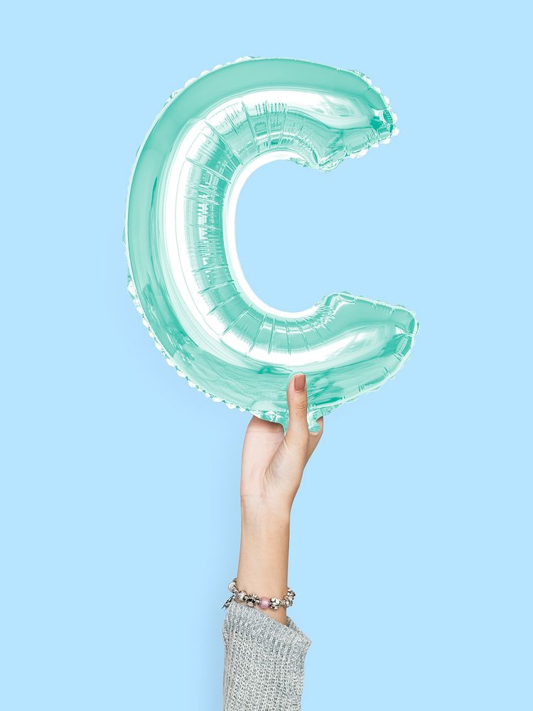 Hand holding balloon letter C
