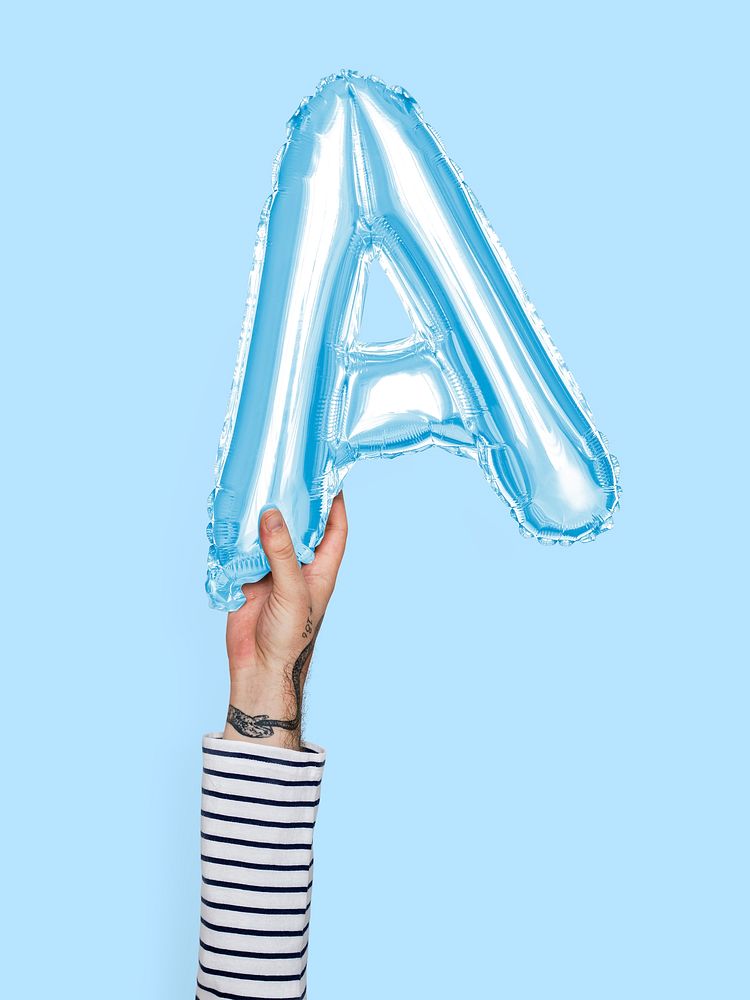 Hand holding balloon letter A