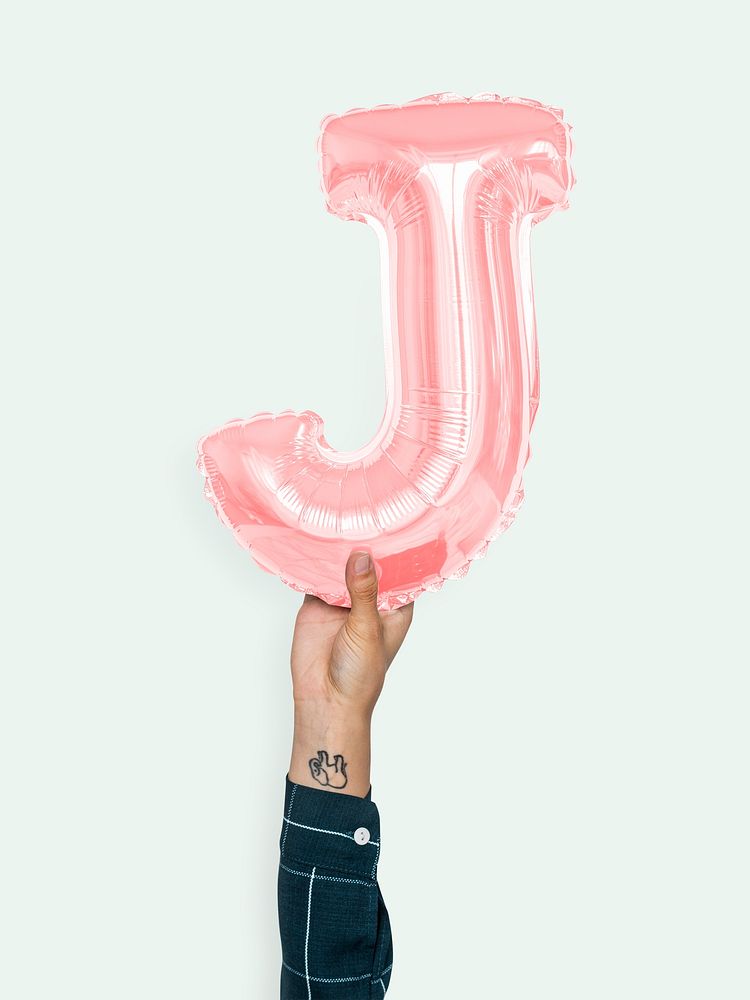Hand holding balloon letter J