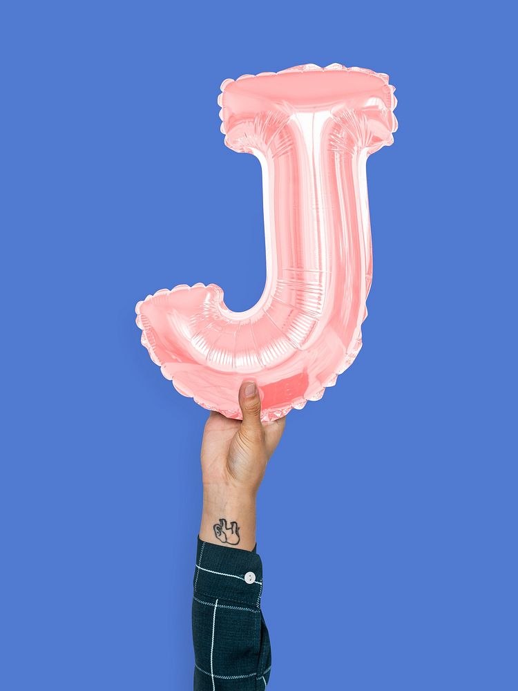 Hand holding balloon letter J