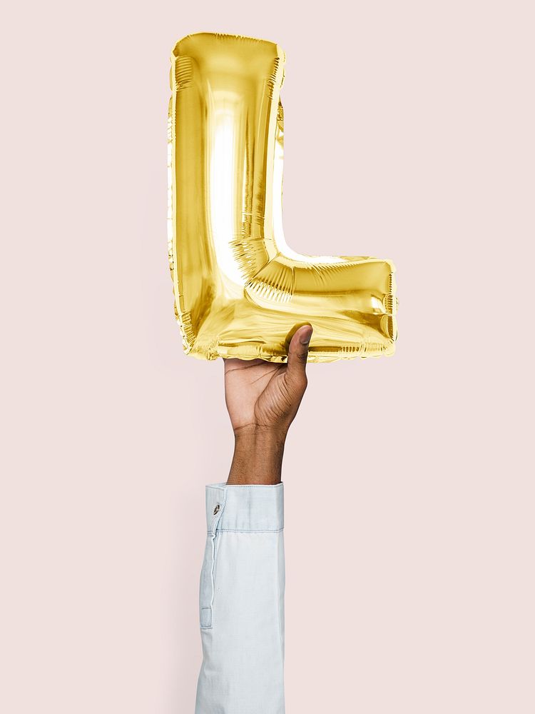 Hand holding balloon letter L