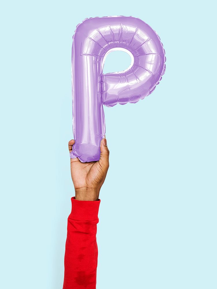 Hand holding balloon letter