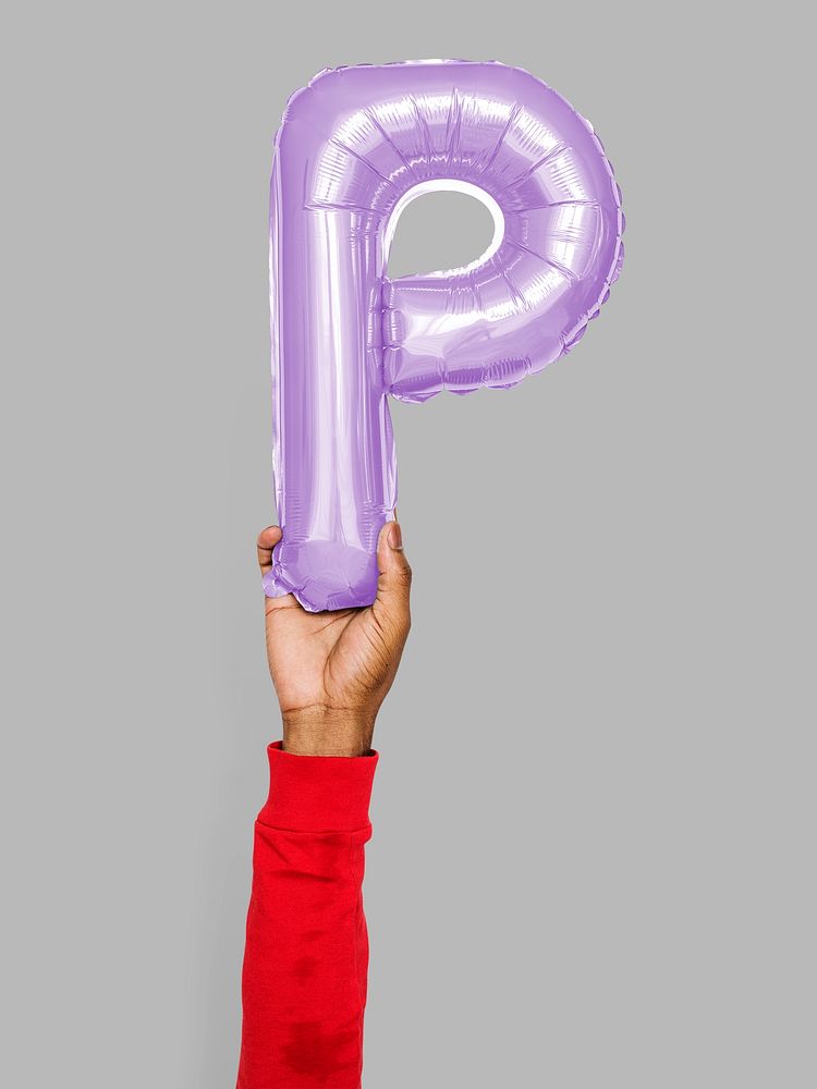 Hand holding balloon letter