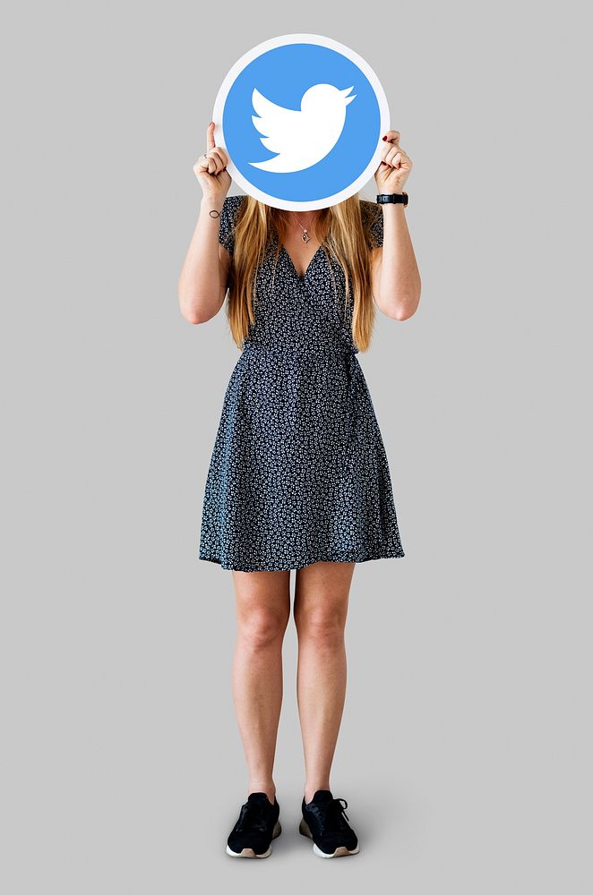 Woman showing a Twitter icon