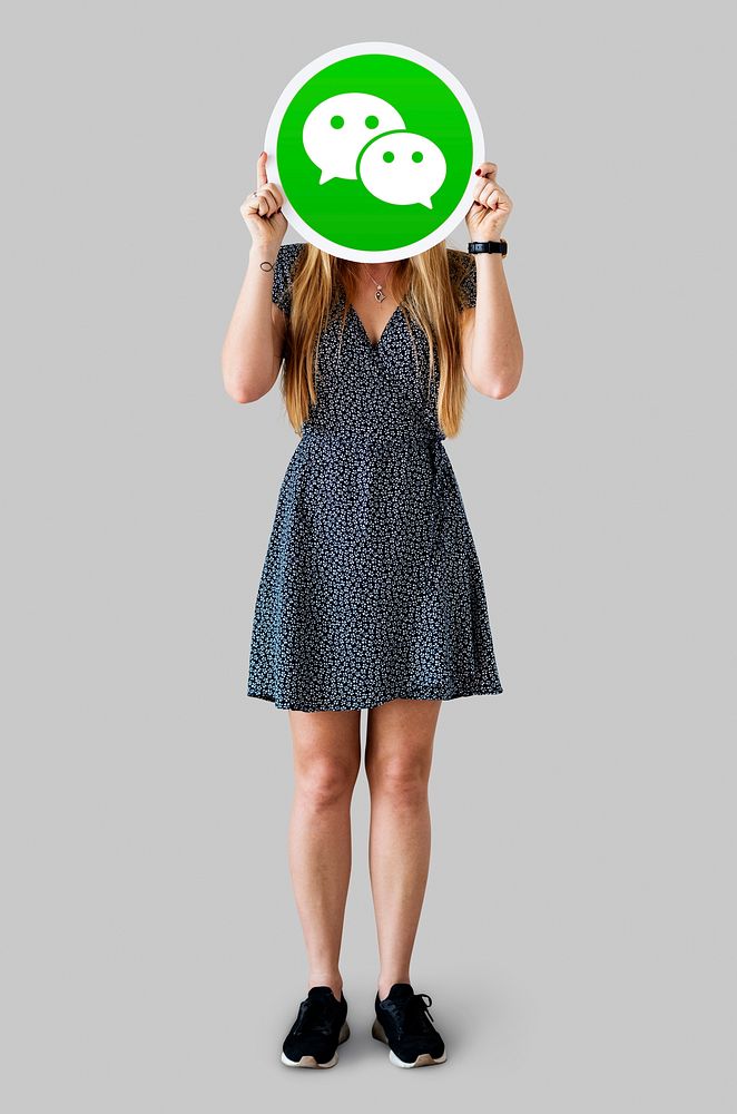 Woman showing a WeChat icon