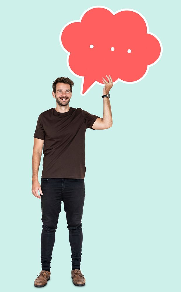 Cheerful man holding a blank speech bubble