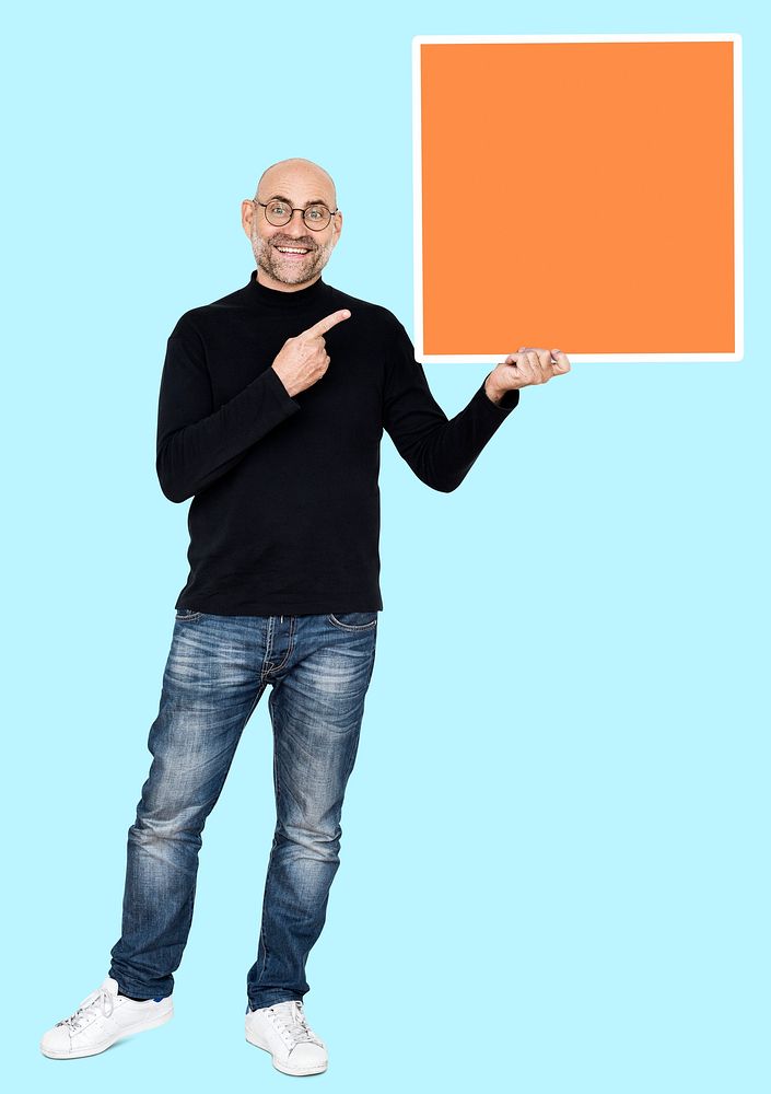 Happy man holding an orange square shaped board