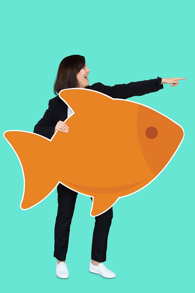 Businesswoman holding a big fish