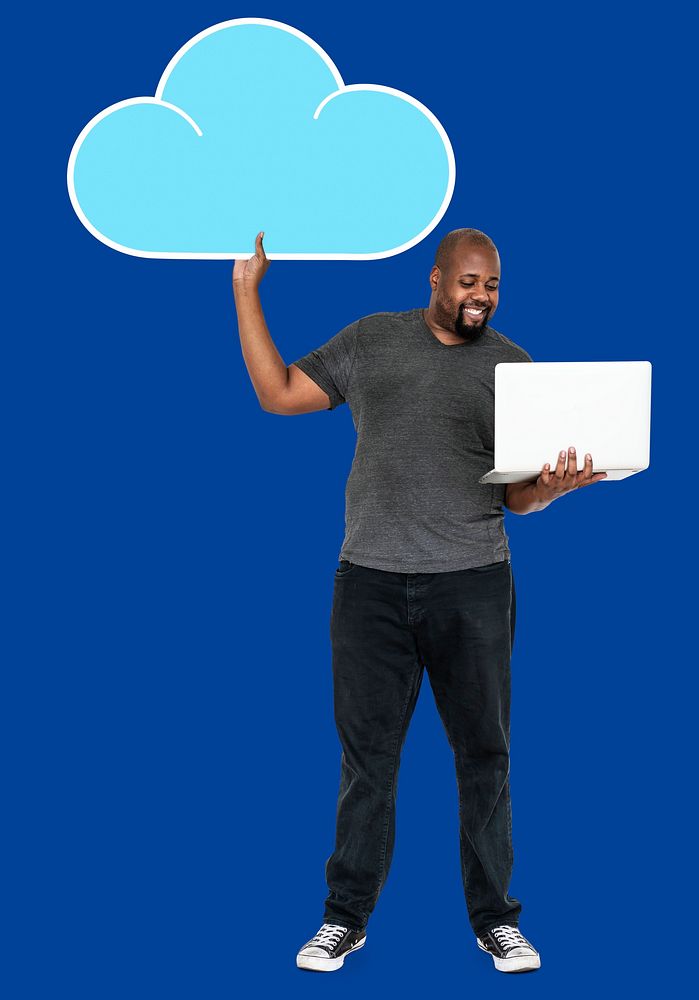 Cheerful man holding an online cloud storage symbol
