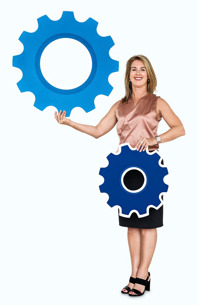 Female leader holding two gears