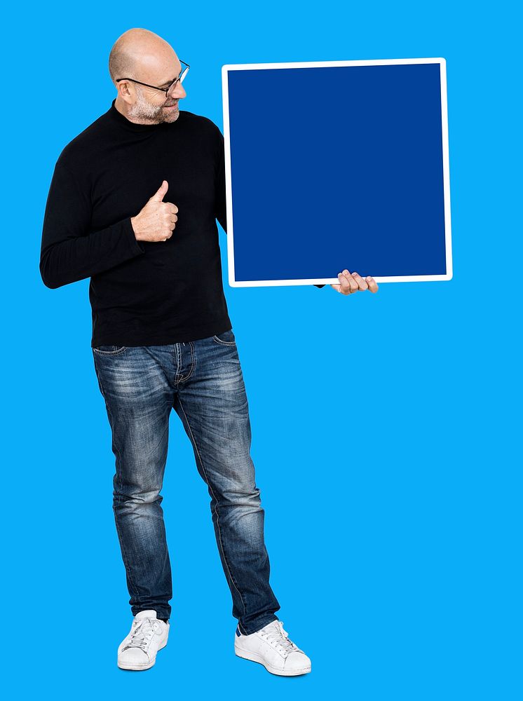 Man showing a thumbs up and a blank board