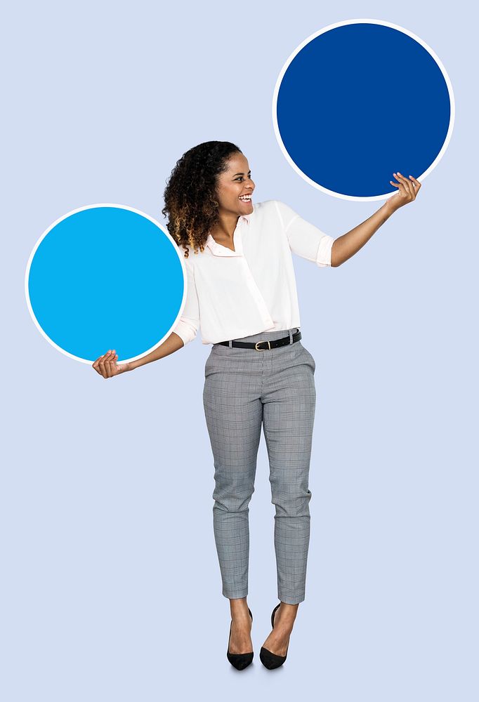 Young businesswoman holding blank circles