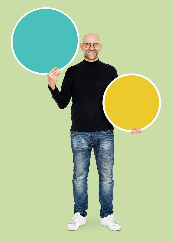 Cheerful man holding a round empty board