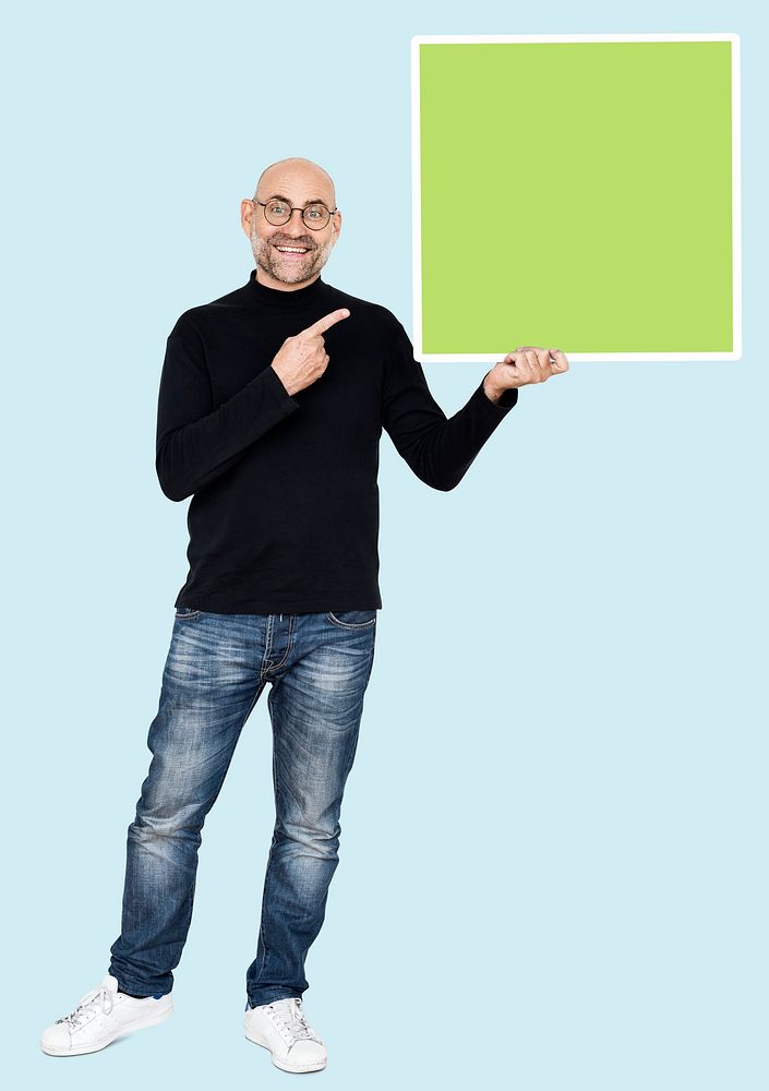 Happy man holding a square shaped board